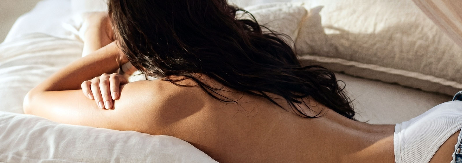 Woman Laying On Bed